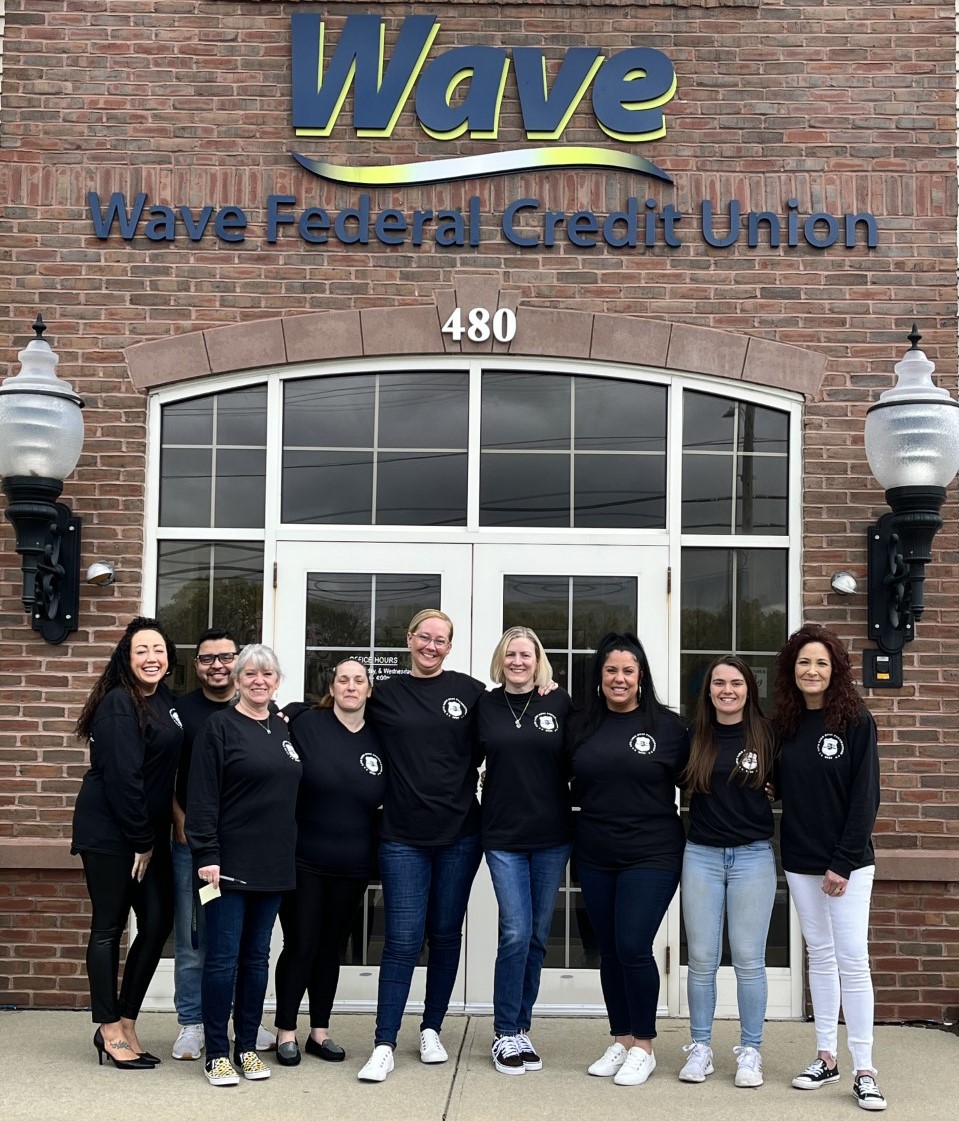 Wave staff dressed causually outside of the bank to support the Live Like Russ Foundation